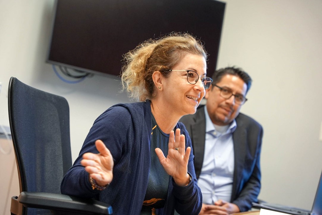 Senior Advisor Beth Baltzan motions during a meeting with Carnegie Mellon University.